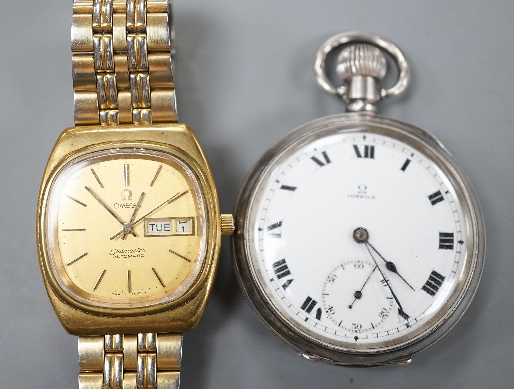 A George V silver Omega open face keyless pocket watch and a gold plated Omega Seamaster day/date automatic wrist watch.